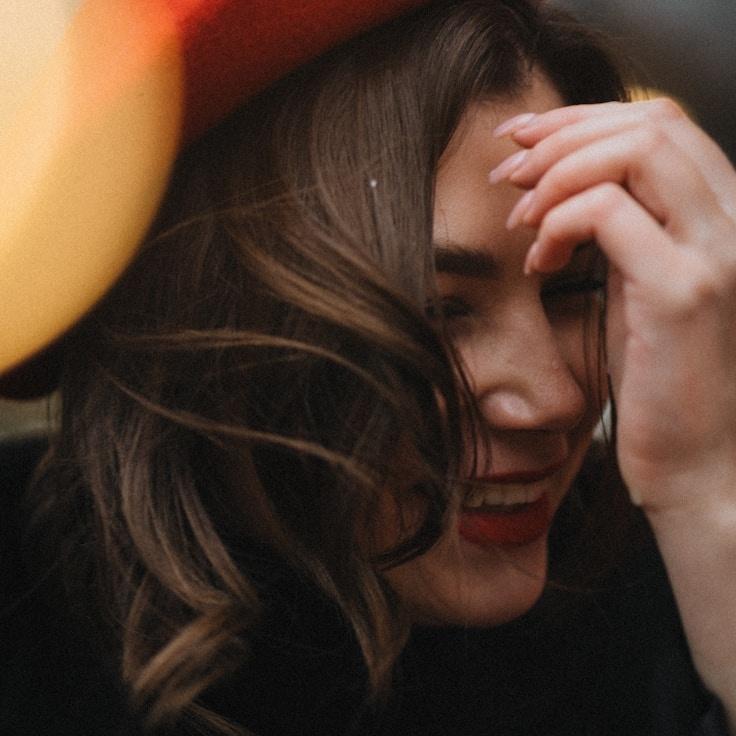 Kaveri Mehta, Lead Design Curator at Quiet Summit Path, reviewing corporate floral arrangements